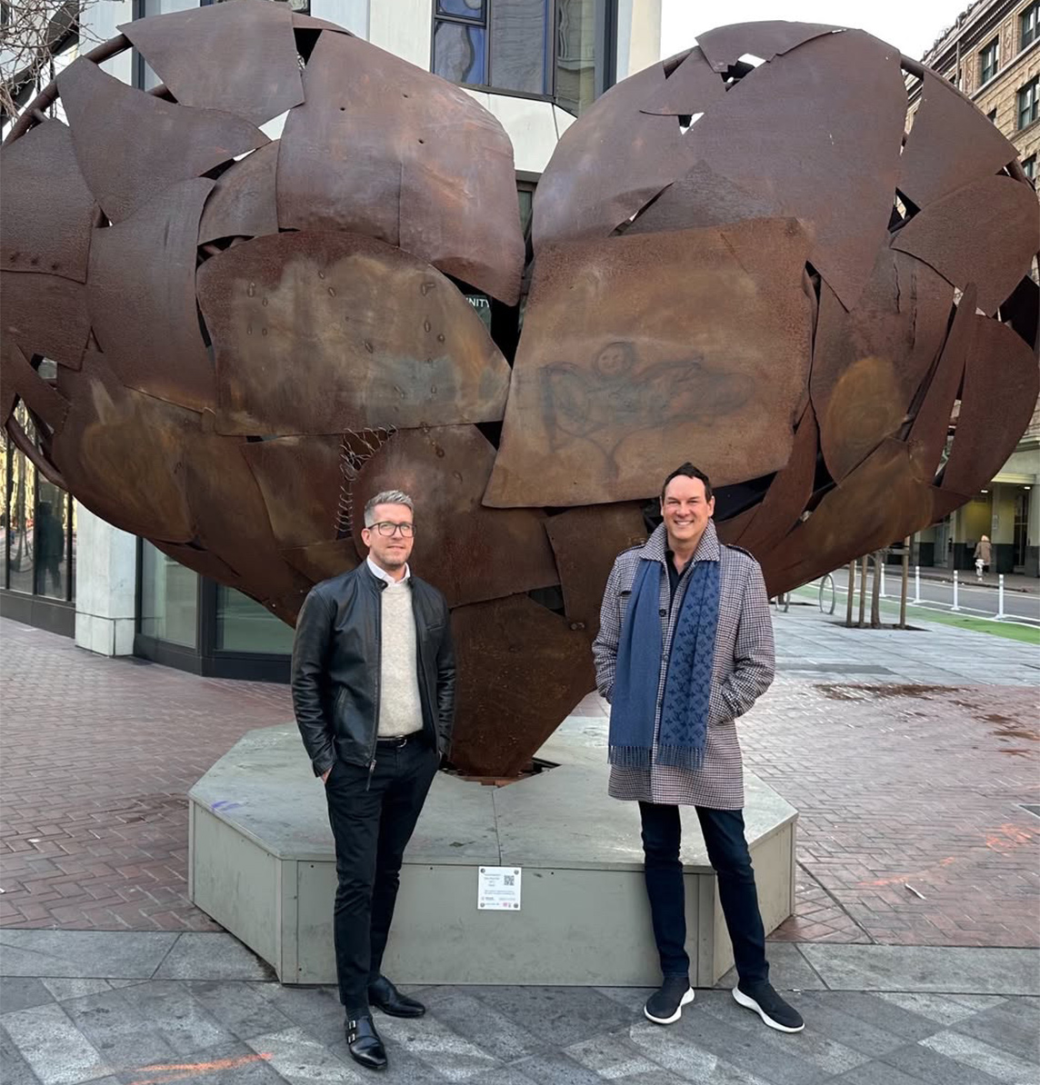 The Polaris Pacific Sales Team at Serif which shares the building with Timbri Hotel stands in front of 'Heartfullness' by Kathy Boynton on Market Street